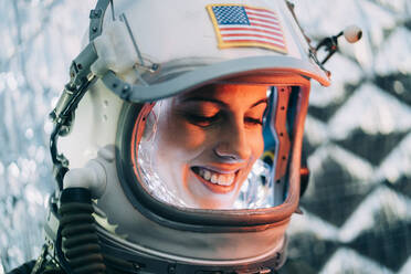 Beautiful woman poses dressed as an astronaut. - ADSF00377