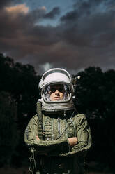 Beautiful woman poses looking at camera dressed as an astronaut. - ADSF00378