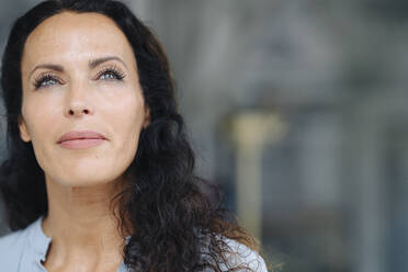 Close-up of woman with gray eyes contemplating outdoors - JOSEF01416