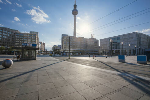 Germany, Berlin, Sun shining over empty Alexanderplatz during COVID-19 pandemic - ZMF00499