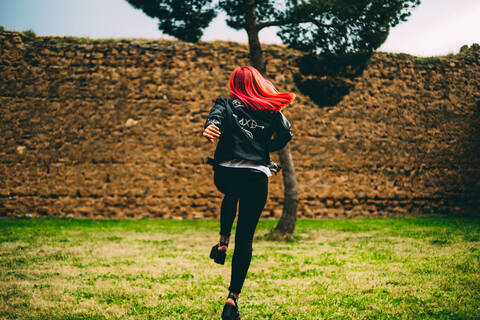 Stylish girl on old stone alley stock photo