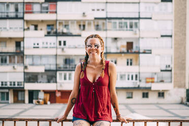 Pretty red-haired girl with braids and sunglasses. It is in the city of Madrid Spain. - ADSF00699