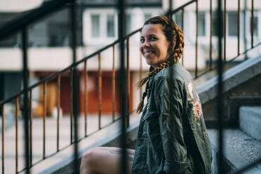 Pretty red-haired girl with braids. It is in the city of Madrid Spain. - ADSF00715