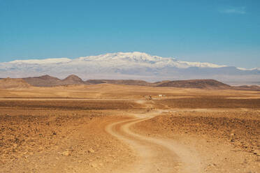 Picturesque view of countryside route between desert with wild lands and blue heaven in Marrakesh, Morocco - ADSF00749