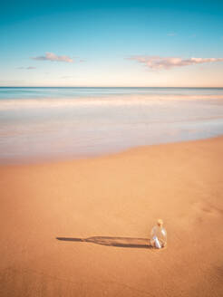 Bottle in sand near sea - ADSF00888