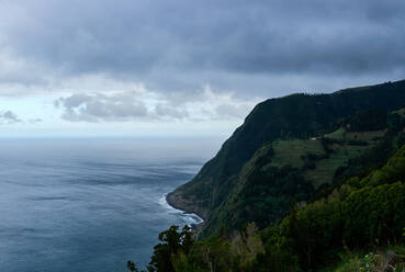 Landscape of the sea and greenish mountain in Sao Miguel, Azores - CAVF86867