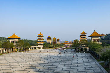 Taiwan, Dashu District, Kaohsiung, Clear sky over pagodas in garden of Fo Guang Shan Monastery - RUNF03880