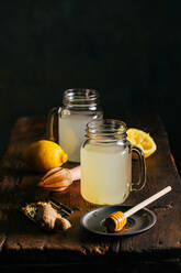 Preparing switchel with lemon juice, ginger and honey - ADSF01247