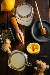 Preparing switchel with lemon juice, ginger and honey - ADSF01248