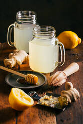 Preparing switchel with lemon juice, ginger and honey - ADSF01249