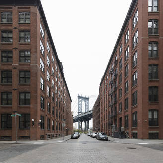 View along empty street towards Manhattan Bridge, New York City, USA during the Corona virus crisis. - CUF55946