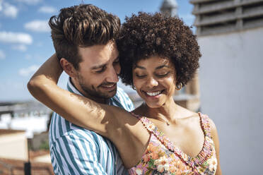 Romantic mid adult couple smiling during sunny day - EHF00613