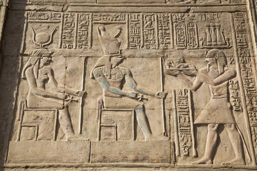 Gods Hathor on left and Haroeris in centre with Pharaoh on the right, Wall Reliefs, Temple of Sobek and Haroeris, Kom Ombo, Egypt, North Africa, Africa - RHPLF16059