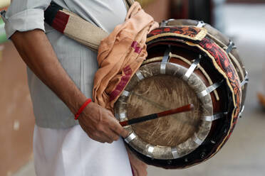 Musician playing a Thavil, a traditional Indian drum, Sri Mahamariamman Hindu Temple, Kuala Lumpur. Malaysia, Southeast Asia, Asia - RHPLF16080