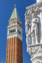 View of the Campanile and sculpture on Doge's Palace in St. Mark's Square, Venice, UNESCO World Heritage Site, Veneto, Italy, Europe - RHPLF16125