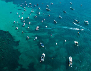 From above different size motorboats and yachts sailing in turquoise ocean water - ADSF01468