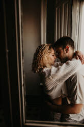 Couple embracing at home - ADSF01491