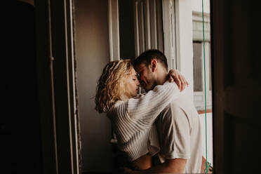 Couple embracing at home - ADSF01492