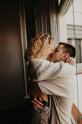 Couple embracing at home - ADSF01493