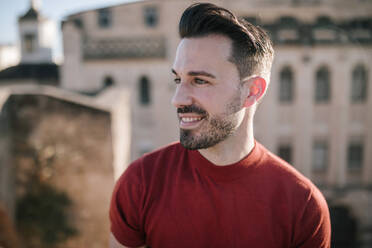 Close-up of smiling young man looking away - GRCF00300