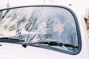 Teen woman inside an old car - ADSF01717
