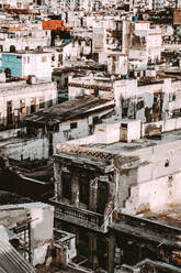 Exterior shot of Cuban city buildings damaged and worn out placed in dense district area. - ADSF01988