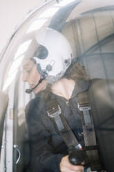 Pilot girl inside her helicopter. - ADSF02171