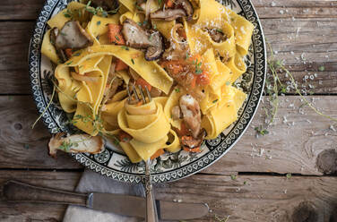 Plate with prepared pappardelle with pumpkin and boletus - ADSF02253