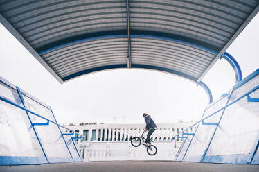 Young man practices with BMX bicycle. - ADSF02417