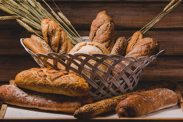 Composition of fresh bread loaves in basket - ADSF02517