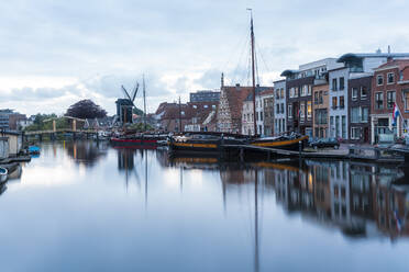 Netherlands, South Holland, Leiden, Sailboat moored in old harbor by Galgewater - TAMF02602