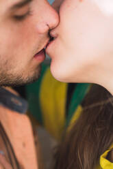 Closeup shot of anonymous man and woman kissing each other at home - ADSF02921