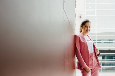 Stylish model in pink on street - ADSF03264