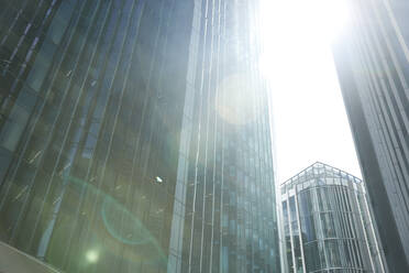 Modern office building against sky during sunny day - PMF01250