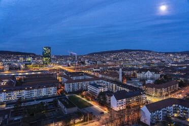 Switzerland, Zurich, Cityscape illuminated at night - TAMF02623