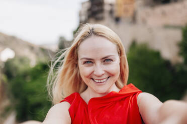 Ballerina walking and dancing over Saint Paul Bridge in Cuenca, Spain - MRRF00135