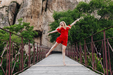Ballerina dancing on Saint Paul Bridge in Cuenca, Spain - MRRF00140