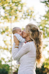 Grandmother holding her grandson with down syndrome - ADSF04061