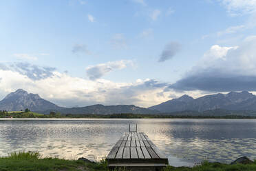 Idyllic view of jetty over lake against sky - DIGF12783