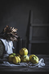 Basket with autumn leaves and exotic fruits - ADSF04455