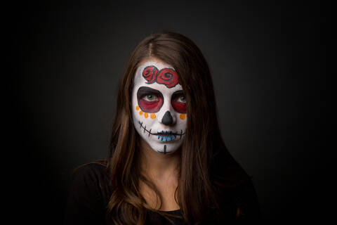 Portrait Of Young Woman Wearing Face Paint Makeup Stock Photo