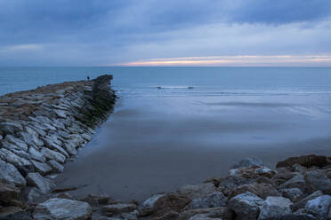 Breakwater facing the sea at sunset south of Spain - ADSF05294