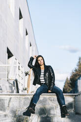 Young woman posing with skateboard - ADSF05334