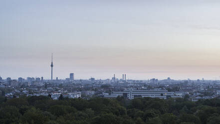 Berlin cityscape and Television Tower beyond Volkspark Friedrichshain park treetops, Germany - FSIF04806