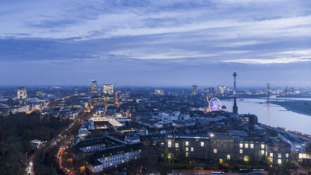 Duesseldorf cityscape illuminated at dusk, North Rhine-Westphalia, Germany - FSIF04871