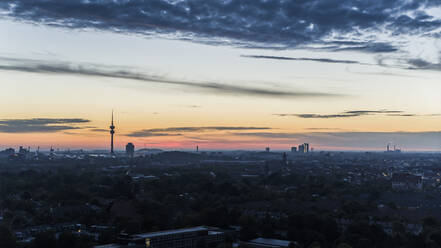 Sunset sky over Munich cityscape, Bavaria, Germany - FSIF04897