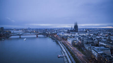 Scenic Rhine River and Cologne cityscape at dusk, Germany - FSIF04909