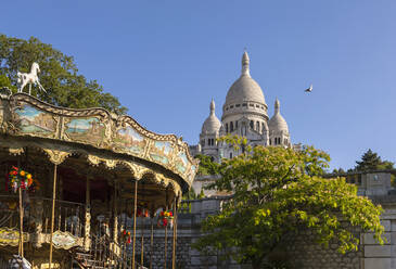 Carousel and Church against clear blue sky, Paris, France - HSIF00803