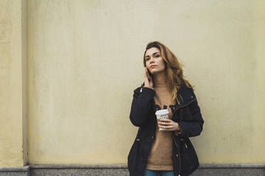 Woman with smartphone and takeaway coffee - ADSF06007