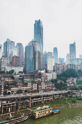 View of old district of Chongqing city with modern glass skyscrapers above, China - ADSF06148